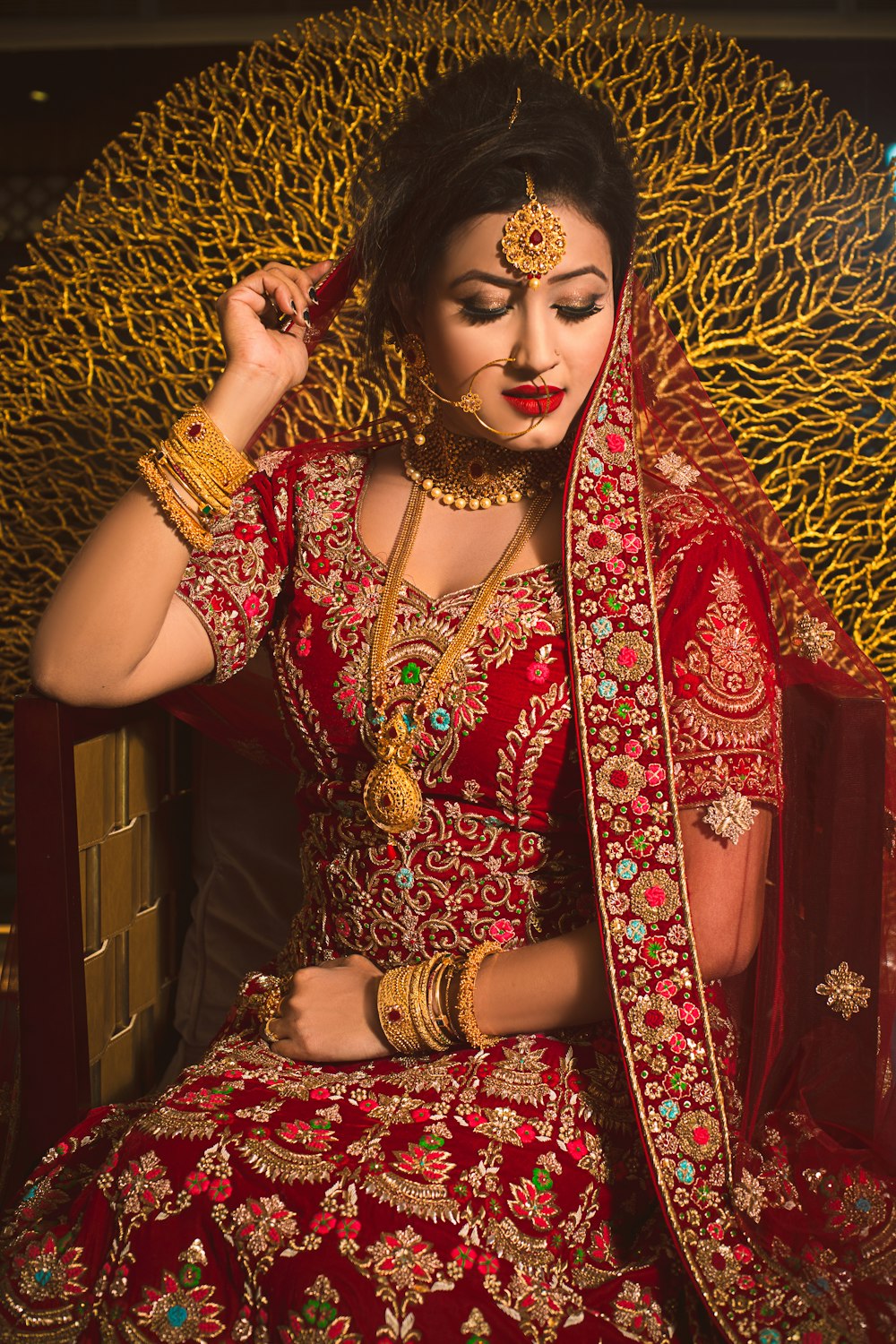 Indian bridal makeup with red and gold jewellery